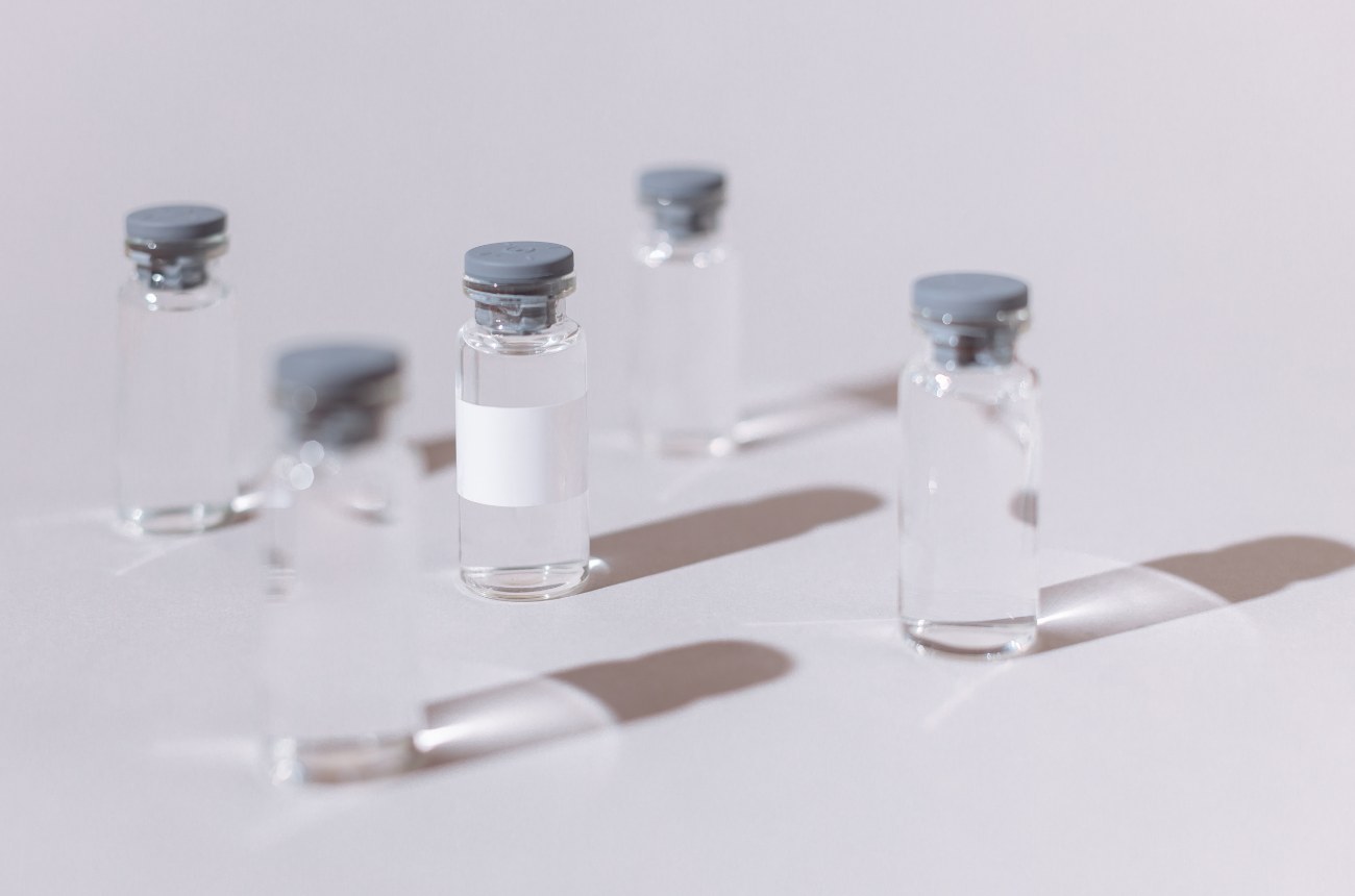 Laboratory vials arranged on a light surface